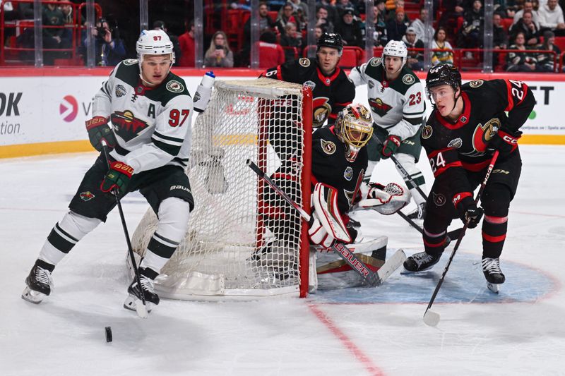 Nov 18, 2023; Stockholm, SWE; Minnesota Wild left wing Kirill Kaprizov (97) skates behind the net as Ottawa Senators goaltender Anton Forsberg (31) and Ottawa Senators defenseman Jacob Bernard-Docker (24) defend during a Global Series NHL hockey game at Avicii Arena. Mandatory Credit: Per Haljestam-USA TODAY Sports