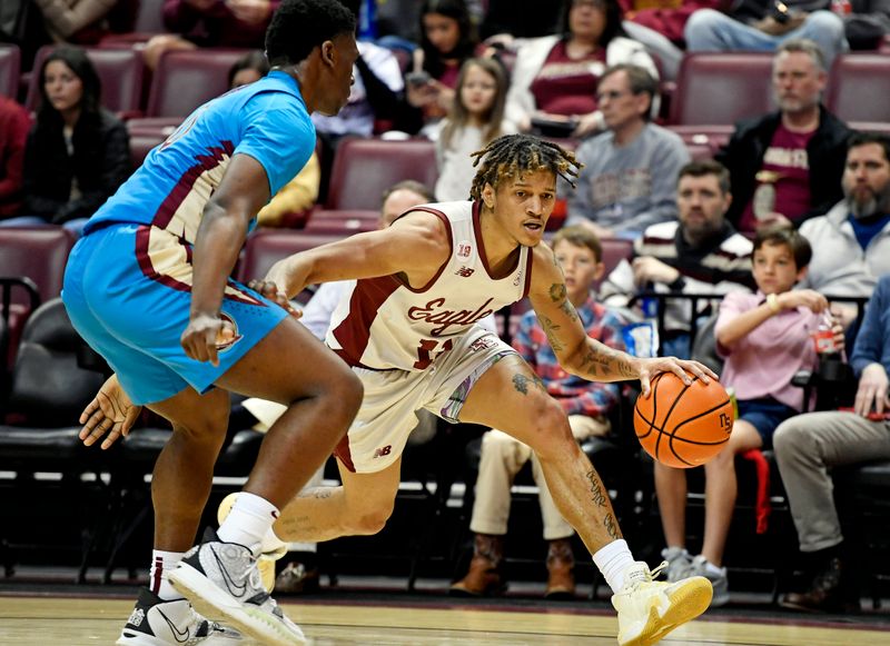 Feb 18, 2023; Tallahassee, Florida, USA; Boston College Eagles guard Makai Ashton-Langford (11) drives to the net past Florida State Seminoles guard Chandler Jackson (0) during the second half at Donald L. Tucker Center. Mandatory Credit: Melina Myers-USA TODAY Sports