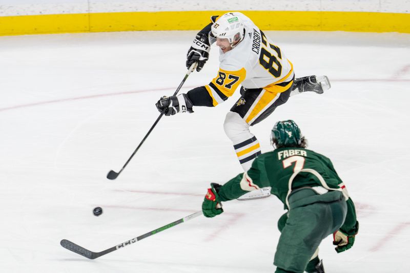 Feb 9, 2024; Saint Paul, Minnesota, USA; Pittsburgh Penguins center Sidney Crosby (87) shoots as Minnesota Wild defenseman Brock Faber (7) defends in the second period at Xcel Energy Center. Mandatory Credit: Matt Blewett-USA TODAY Sports