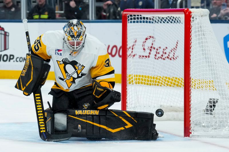Nov 28, 2025; Columbus, Ohio, USA;  Pittsburgh Penguins goaltender Tristan Jarry (35) makes a save in net against the Columbus Blue Jackets in the second period at Nationwide Arena. Mandatory Credit: Aaron Doster-Imagn Images