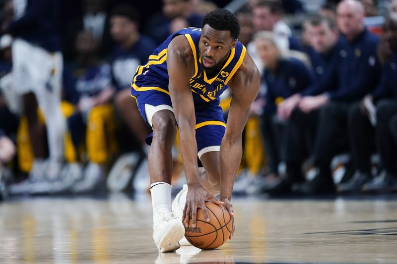 INDIANAPOLIS, INDIANA - FEBRUARY 08: Andrew Wiggins #22 of the Golden State Warriors picks up the ball in the first quarter against the Indiana Pacers at Gainbridge Fieldhouse on February 08, 2024 in Indianapolis, Indiana. NOTE TO USER: User expressly acknowledges and agrees that, by downloading and or using this photograph, User is consenting to the terms and conditions of the Getty Images License Agreement. (Photo by Dylan Buell/Getty Images)