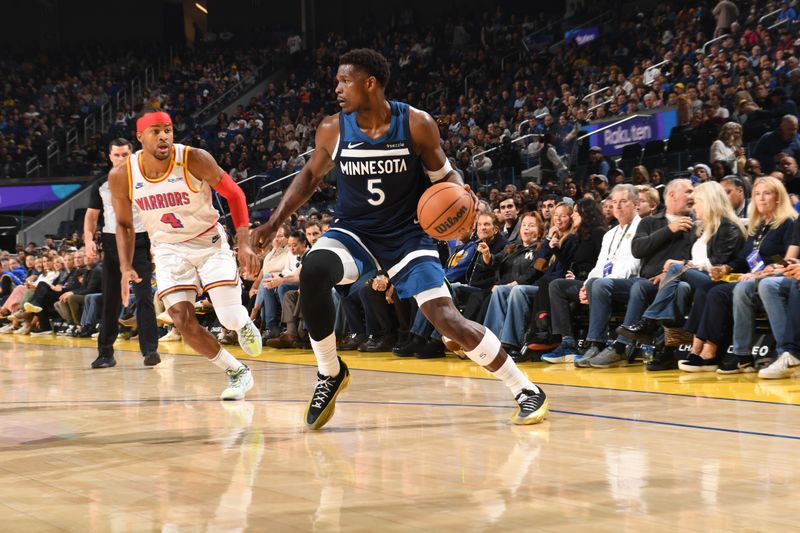 SAN FRANCISCO, CA - DECEMBER 8: Anthony Edwards #5 of the Minnesota Timberwolves dribbles the ball during the game against the Golden State Warriors during a regular season game on December 8, 2024 at Chase Center in San Francisco, California. NOTE TO USER: User expressly acknowledges and agrees that, by downloading and or using this photograph, user is consenting to the terms and conditions of Getty Images License Agreement. Mandatory Copyright Notice: Copyright 2024 NBAE (Photo by Noah Graham/NBAE via Getty Images)