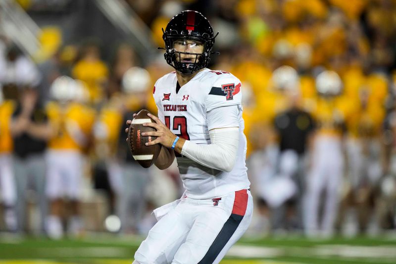 Sep 2, 2023; Laramie, Wyoming, USA; Texas Tech Red Raiders quarterback Tyler Shough (12) drops back to pass against the Wyoming Cowboys during the fourth quarter at Jonah Field at War Memorial Stadium. Mandatory Credit: Troy Babbitt-USA TODAY Sports