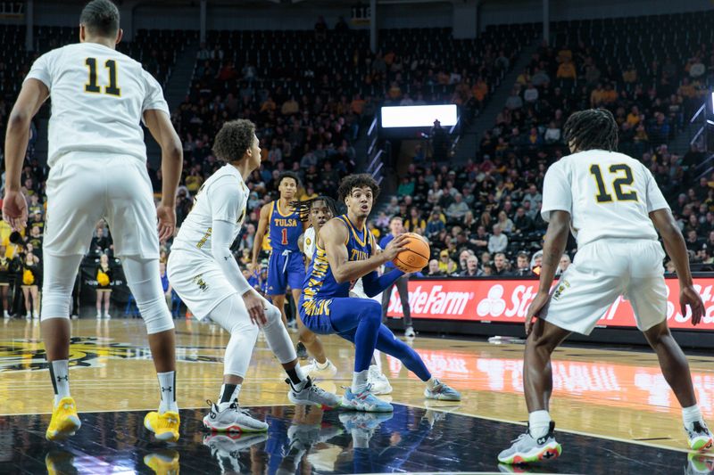 Jan 14, 2023; Wichita, Kansas, USA; Tulsa Golden Hurricane guard Brian Knight (4) looks for an opening against the Wichita State Shockers during the first half at Charles Koch Arena. Mandatory Credit: William Purnell-USA TODAY Sports