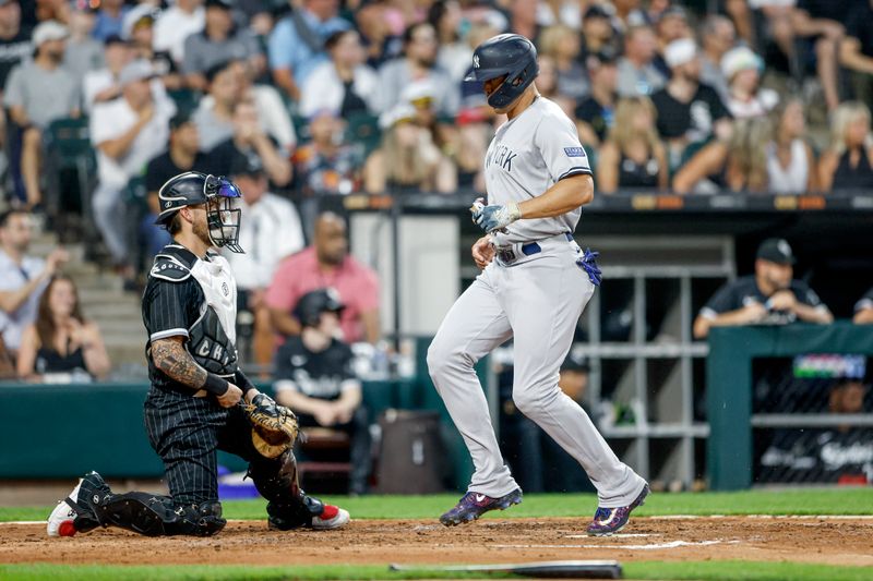 Aug 8, 2023; Chicago, Illinois, USA; New York Yankees designated hitter Giancarlo Stanton (27) scores against the Chicago White Sox during the fourth inning at Guaranteed Rate Field. Mandatory Credit: Kamil Krzaczynski-USA TODAY Sports