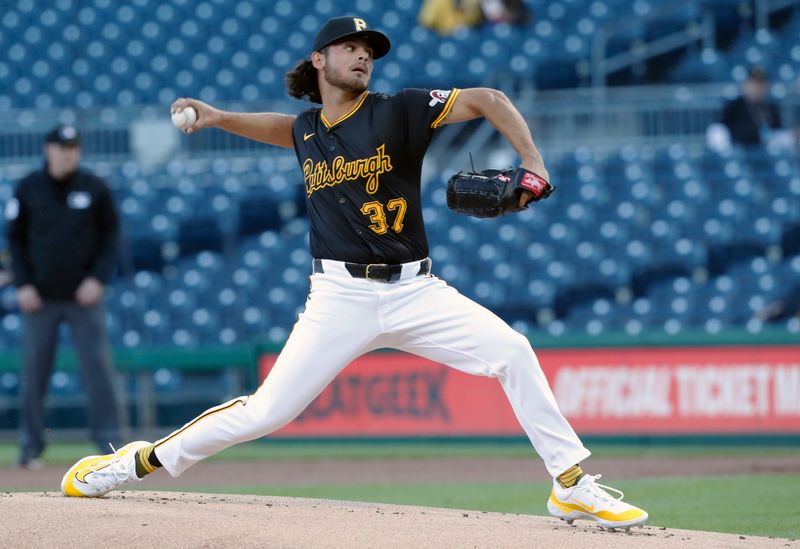 Apr 22, 2024; Pittsburgh, Pennsylvania, USA;  Pittsburgh Pirates starting pitcher Jared Jones (37) delivers a pitch against the Milwaukee Brewers during the first inning at PNC Park. Mandatory Credit: Charles LeClaire-USA TODAY Sports