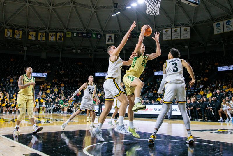 Jan 14, 2025; Wichita, Kansas, USA; Charlotte 49ers forward Rich Rolf (24) goes for a layup during the second half against the Wichita State Shockers at Charles Koch Arena. Mandatory Credit: William Purnell-Imagn Images