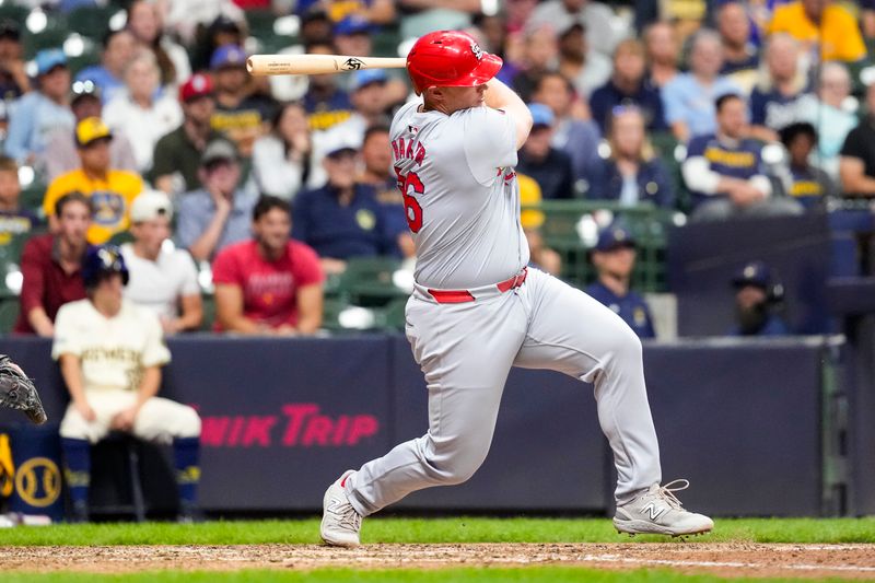 Sep 4, 2024; Milwaukee, Wisconsin, USA;  St. Louis Cardinals pinch hitter Luken Baker (26) singles during the tenth inning against the Milwaukee Brewers at American Family Field. Mandatory Credit: Jeff Hanisch-Imagn Images