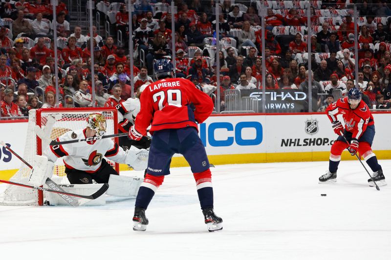 Apr 7, 2024; Washington, District of Columbia, USA; Washington Capitals left wing Max Pacioretty (67) scores a goal on Ottawa Senators goaltender Joonas Korpisalo (70) in the first period at Capital One Arena. Mandatory Credit: Geoff Burke-USA TODAY Sports