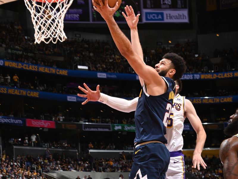 LOS ANGELES, CA - APRIL 27: Jamal Murray #27 of the Denver Nuggets drives to the basket during the game against the Los Angeles Lakers during Round 1 Game 4 of the 2024 NBA Playoffs on April 27, 2024 at Crypto.Com Arena in Los Angeles, California. NOTE TO USER: User expressly acknowledges and agrees that, by downloading and/or using this Photograph, user is consenting to the terms and conditions of the Getty Images License Agreement. Mandatory Copyright Notice: Copyright 2024 NBAE (Photo by Andrew D. Bernstein/NBAE via Getty Images)