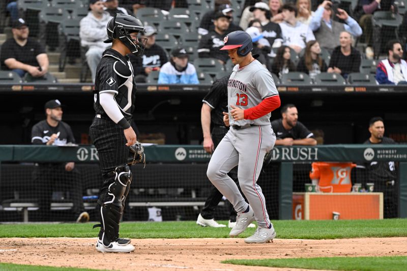 May 14, 2024; Chicago, Illinois, USA; Washington Nationals third baseman Nick Senzel (13) scores against the Chicago White Sox during the eighth inning at Guaranteed Rate Field. Mandatory Credit: Matt Marton-USA TODAY Sports