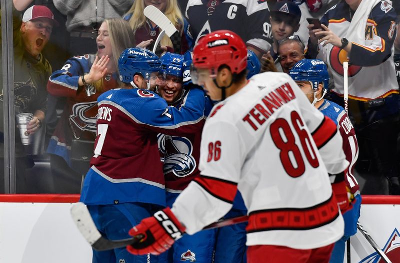 Oct 21, 2023; Denver, Colorado, USA;  Colorado Avalanche right wing Logan O'Connor (25) is congratulated by Colorado Avalanche defenseman Devon Toews (7) after his short handed goal in the second period against the Carolina Hurricanes at Ball Arena. Mandatory Credit: John Leyba-USA TODAY Sports