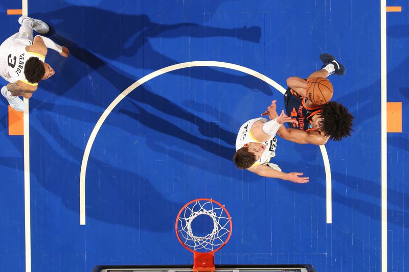 NEW YORK, NY - JANUARY 30: Jericho Sims #45 of the New York Knicks drives to the basket during the game against the Utah Jazz on January 30, 2024 at Madison Square Garden in New York City, New York.  NOTE TO USER: User expressly acknowledges and agrees that, by downloading and or using this photograph, User is consenting to the terms and conditions of the Getty Images License Agreement. Mandatory Copyright Notice: Copyright 2024 NBAE  (Photo by Nathaniel S. Butler/NBAE via Getty Images)