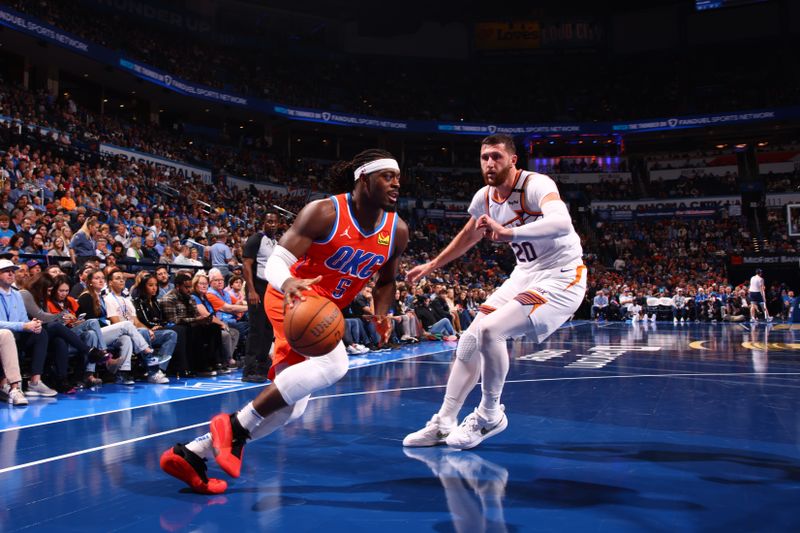 OKLAHOMA CITY, OK - NOVEMBER 15: Luguentz Dort #5 of the Oklahoma City Thunder drives to the basket during the game against the Phoenix Suns during the Emirates NBA Cup game on November 15, 2024 at Paycom Center in Oklahoma City, Oklahoma. NOTE TO USER: User expressly acknowledges and agrees that, by downloading and or using this photograph, User is consenting to the terms and conditions of the Getty Images License Agreement. Mandatory Copyright Notice: Copyright 2024 NBAE (Photo by Zach Beeker/NBAE via Getty Images)