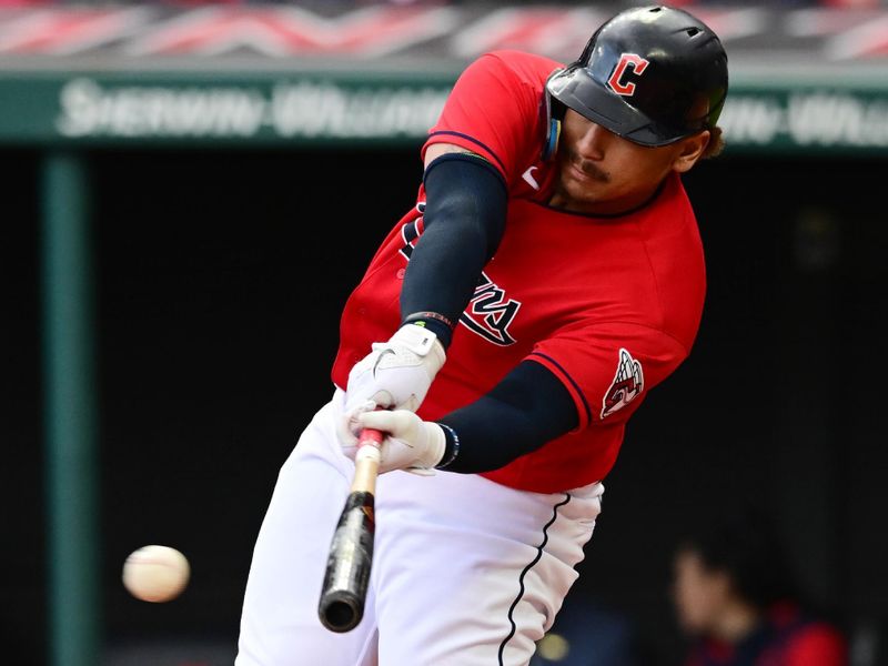 Apr 23, 2023; Cleveland, Ohio, USA; Cleveland Guardians first baseman Josh Naylor (22) hits a single during the third inning against the Miami Marlins at Progressive Field. Mandatory Credit: Ken Blaze-USA TODAY Sports