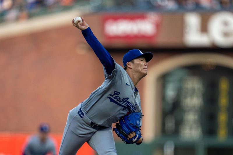 May 13, 2024; San Francisco, California, USA; Los Angeles Dodgers starting pitcher Yoshinobu Yamamoto (18) delivers a pitch against the San Francisco Giants during the first inning at Oracle Park. Mandatory Credit: Neville E. Guard-USA TODAY Sports