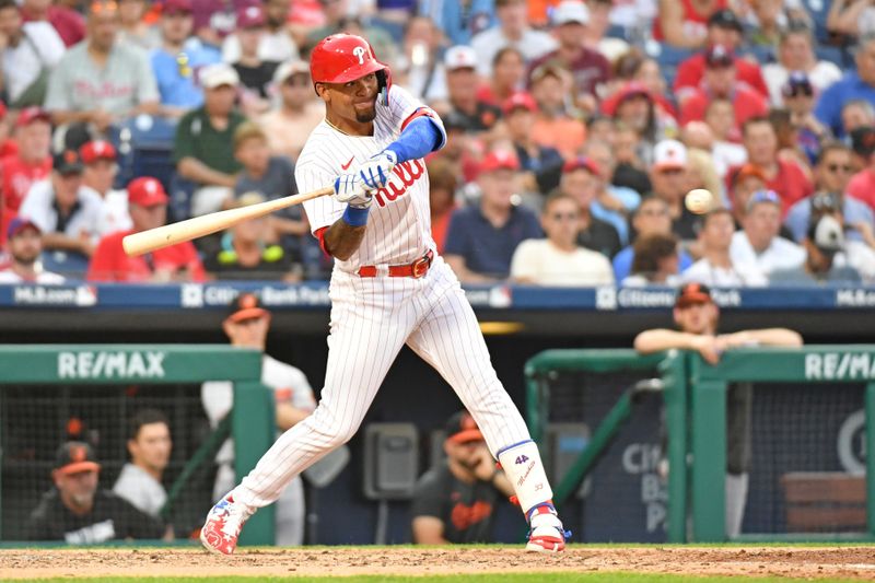 Jul 26, 2023; Philadelphia, Pennsylvania, USA; Philadelphia Phillies third baseman Edmundo Sosa (33) hits a home run against the Baltimore Orioles during the seventh inning at Citizens Bank Park. Mandatory Credit: Eric Hartline-USA TODAY Sports