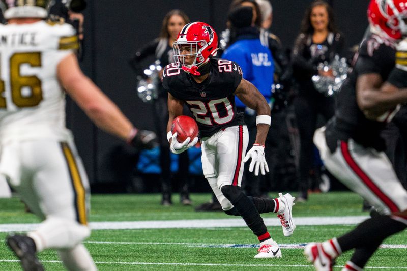 Atlanta Falcons cornerback Dee Alford (20) runs the ball during the first half of an NFL football game against the New Orleans Saints, Sunday, Nov. 26, 2023, in Atlanta. The Atlanta Falcons won 24-15. (AP Photo/Danny Karnik)