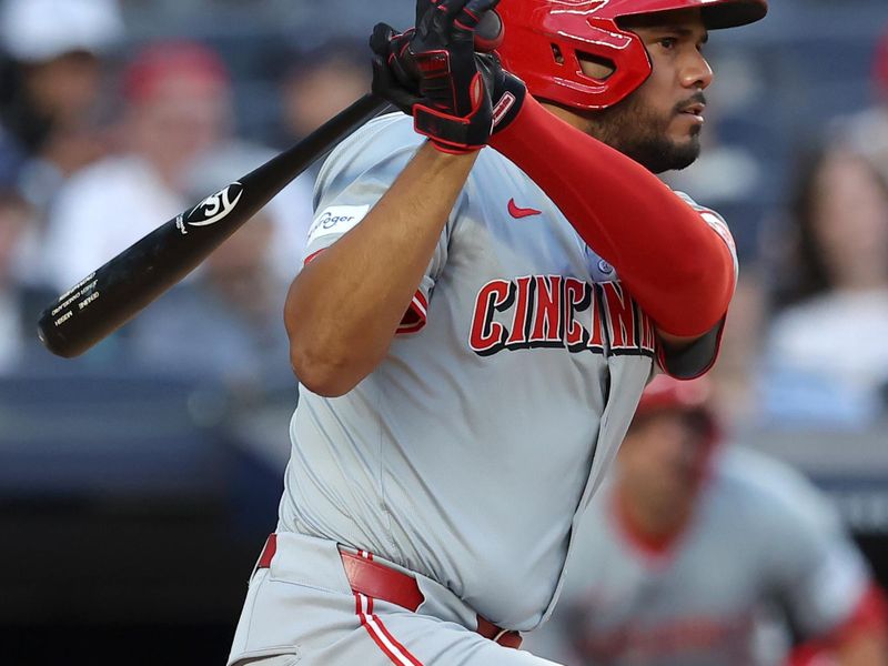 Jul 2, 2024; Bronx, New York, USA; Cincinnati Reds designated hitter Jeimer Candelario (3) follows through on an RBI ground out against the New York Yankees during the fourth inning at Yankee Stadium. Mandatory Credit: Brad Penner-USA TODAY Sports