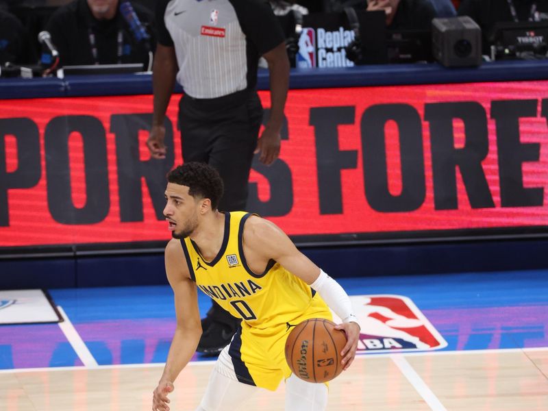 OKLAHOMA CITY, OK - JUNE 8: Tyrese Haliburton #0 of the Indiana Pacers dribbles the ball during the game against the Oklahoma City Thunder during Game 2 of the 2025 NBA Finals on June 8, 2025 at Paycom Center in Oklahoma City, Oklahoma. NOTE TO USER: User expressly acknowledges and agrees that, by downloading and or using this photograph, User is consenting to the terms and conditions of the Getty Images License Agreement. Mandatory Copyright Notice: Copyright 2025 NBAE (Photo by Joe Murphy/NBAE via Getty Images)