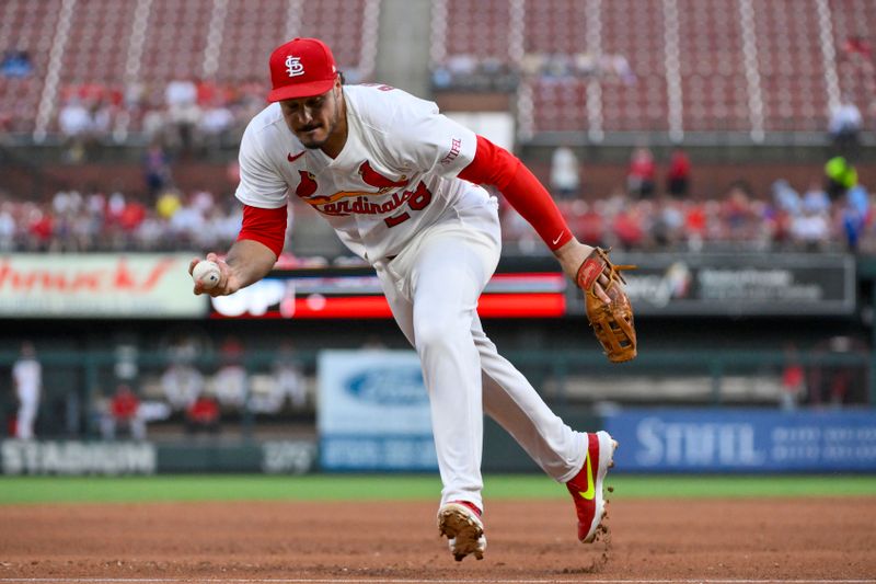 Jun 24, 2025; St. Louis, Missouri, USA;  St. Louis Cardinals third baseman Nolan Arenado (28) fields a ground ball against the Chicago Cubs during the fifth inning at Busch Stadium. Mandatory Credit: Jeff Curry-Imagn Images