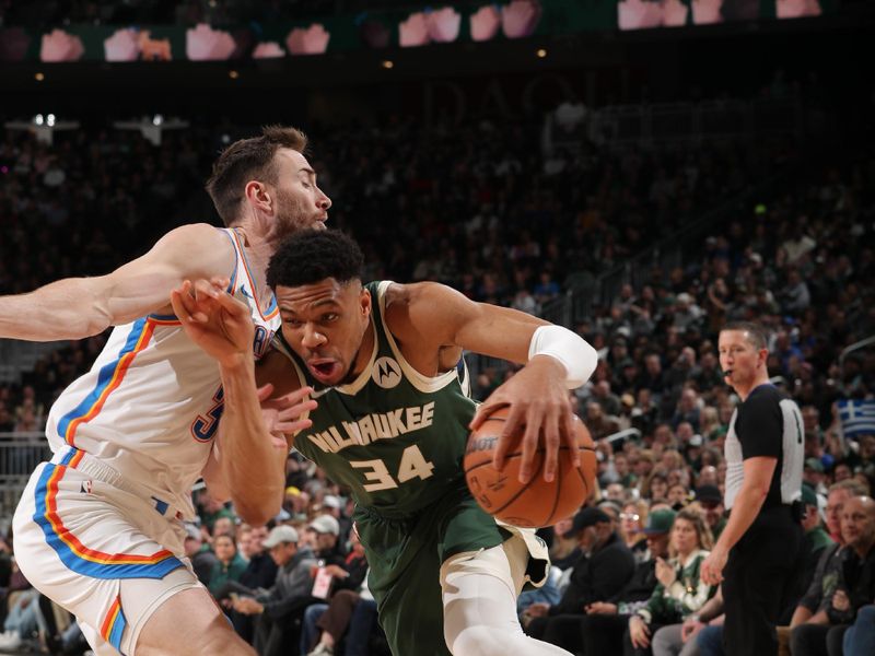 MILWAUKEE, WI - MARCH 24:  Giannis Antetokounmpo #34 of the Milwaukee Bucks handles the ball during the game against the Oklahoma City Thunder on March 24, 2024 at the Fiserv Forum Center in Milwaukee, Wisconsin. NOTE TO USER: User expressly acknowledges and agrees that, by downloading and or using this Photograph, user is consenting to the terms and conditions of the Getty Images License Agreement. Mandatory Copyright Notice: Copyright 2024 NBAE (Photo by Gary Dineen/NBAE via Getty Images).