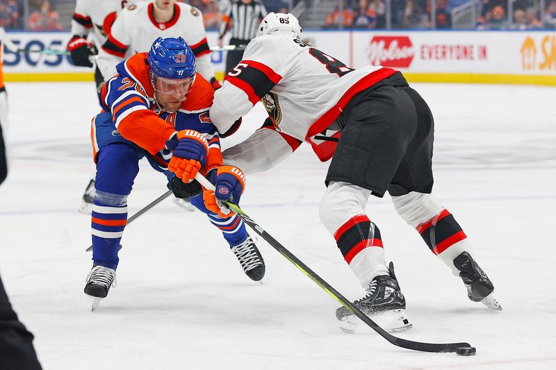 Jan 6, 2024; Edmonton, Alberta, CAN; Edmonton Oilers (29) tries to move the puck around Ottawa Senators defensemen Jake Sanderson (85) during the first period at Rogers Place. Mandatory Credit: Perry Nelson-USA TODAY Sports