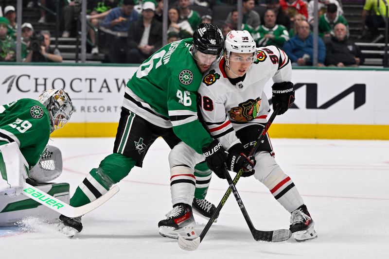 Nov 7, 2024; Dallas, Texas, USA; Chicago Blackhawks center Connor Bedard (98) skates Dallas Stars defenseman Ilya Lyubushkin (46) and goaltender Jake Oettinger (29) during the first period at the American Airlines Center. Mandatory Credit: Jerome Miron-Imagn Images