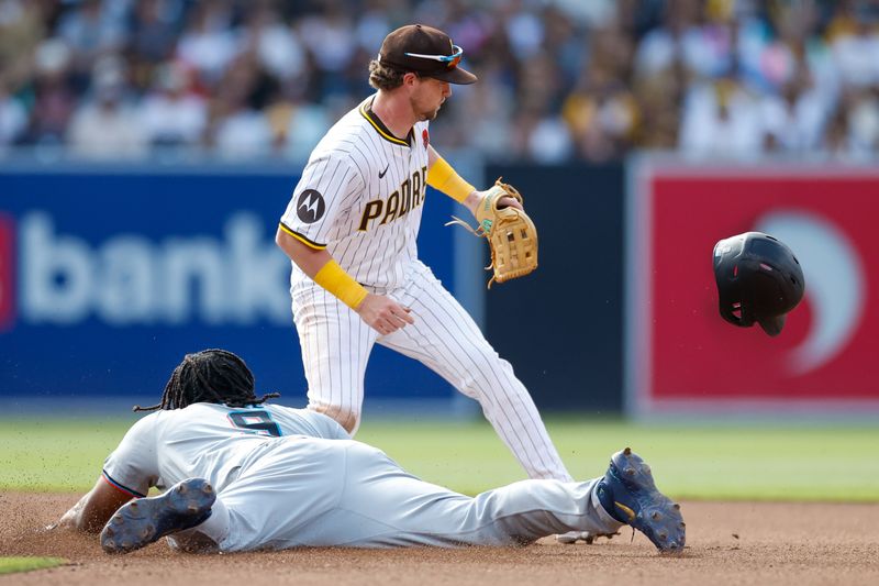 May 27, 2024; San Diego, California, USA; Miami Marlins first baseman Josh Bell (9) slides into second base for a double in the fourth inning against the San Diego Padres  at Petco Park. Mandatory Credit: David Frerker-USA TODAY Sports