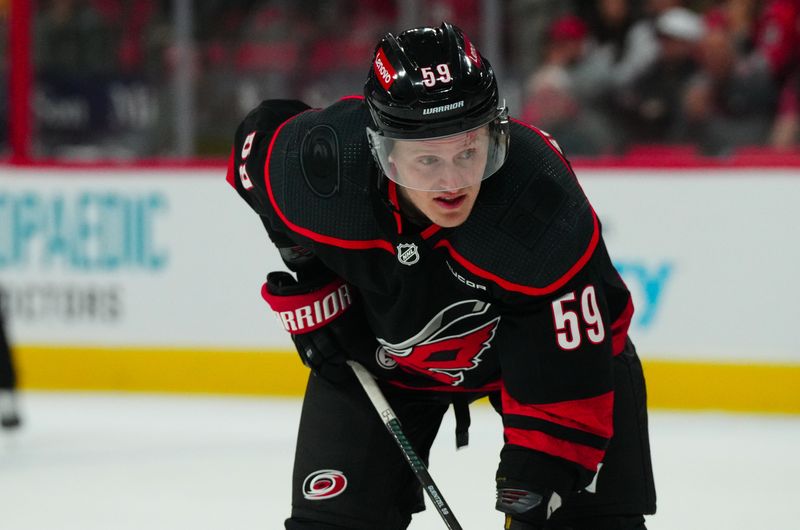 Mar 12, 2024; Raleigh, North Carolina, USA; Carolina Hurricanes left wing Jake Guentzel (59) looks on against the New York Rangers during the third period at PNC Arena. Mandatory Credit: James Guillory-USA TODAY Sports