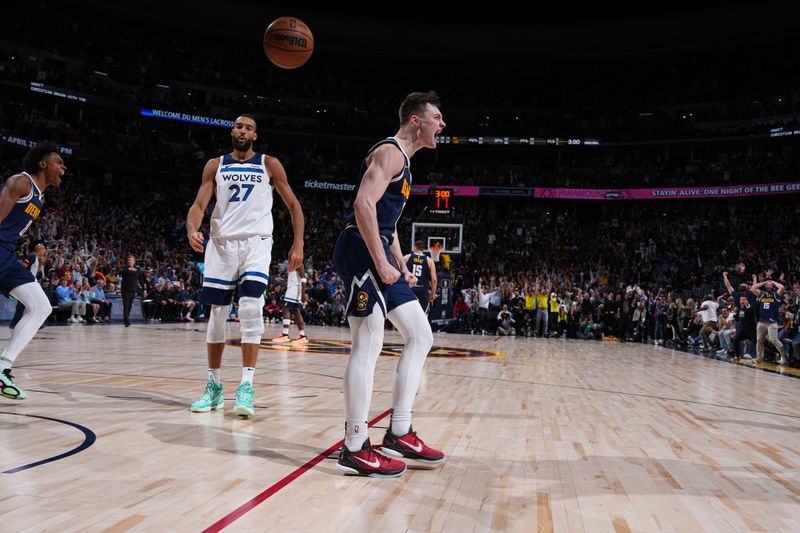 DENVER, CO - APRIL 10: Christian Braun #0 of the Denver Nuggets celebrates during the game against the Minnesota Timberwolves on April 10, 2024 at the Ball Arena in Denver, Colorado. NOTE TO USER: User expressly acknowledges and agrees that, by downloading and/or using this Photograph, user is consenting to the terms and conditions of the Getty Images License Agreement. Mandatory Copyright Notice: Copyright 2024 NBAE (Photo by Garrett Ellwood/NBAE via Getty Images)