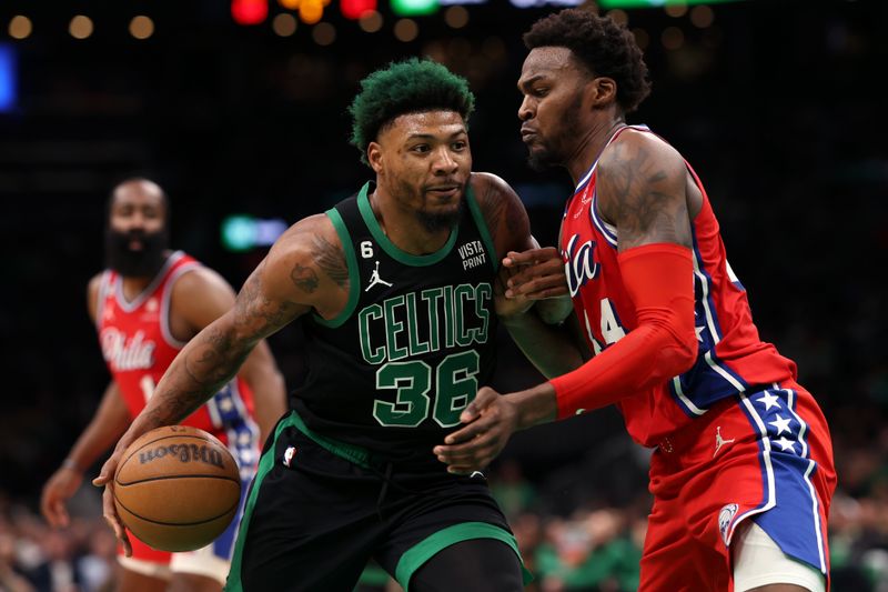 BOSTON, MASSACHUSETTS - MAY 01: Marcus Smart #36 of the Boston Celtics dribbles against Paul Reed #44 of the Philadelphia 76ers during the second half in game one of the Eastern Conference Second Round Playoffs  at TD Garden on May 01, 2023 in Boston, Massachusetts. NOTE TO USER: User expressly acknowledges and agrees that, by downloading and or using this photograph, User is consenting to the terms and conditions of the Getty Images License Agreement.  (Photo by Maddie Meyer/Getty Images)