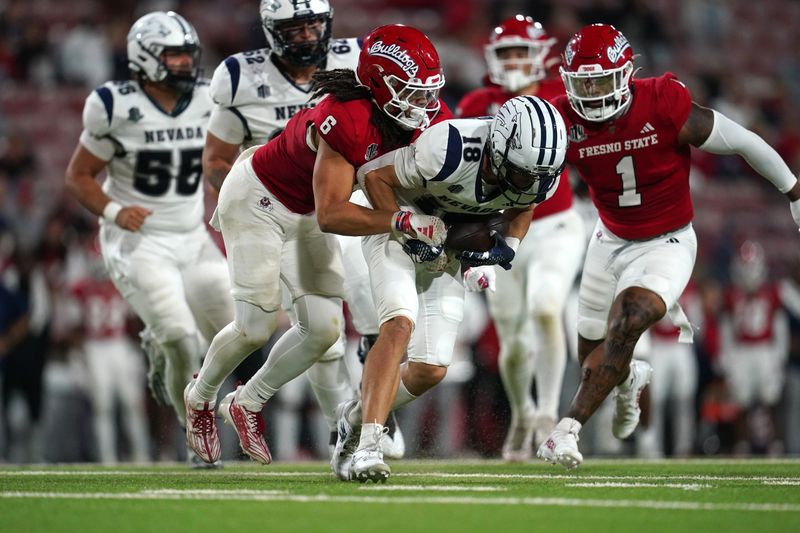 Sep 30, 2023; Fresno, California, USA; Fresno State Bulldogs linebacker Levelle Bailey (6) tackles Nevada Wolf Pack wide receiver Spencer Curtis (18) in the fourth quarter at Valley Children's Stadium. Mandatory Credit: Cary Edmondson-USA TODAY Sports