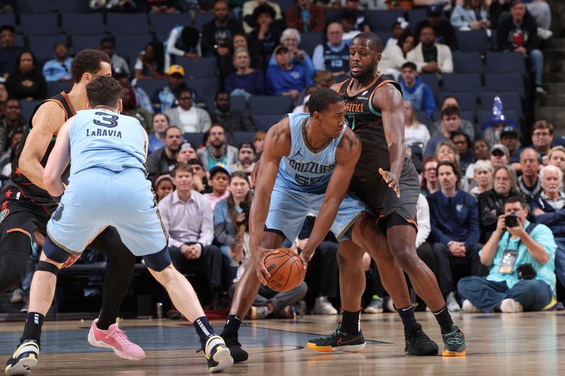 MEMPHIS, TN - MARCH 12: Trey Jemison #55 of the Memphis Grizzlies handles the ball during the game against the Washington Wizards on March 12, 2024 at FedExForum in Memphis, Tennessee. NOTE TO USER: User expressly acknowledges and agrees that, by downloading and or using this photograph, User is consenting to the terms and conditions of the Getty Images License Agreement. Mandatory Copyright Notice: Copyright 2024 NBAE (Photo by Joe Murphy/NBAE via Getty Images)