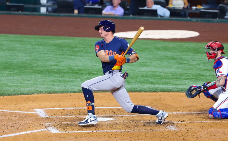 Aug 6, 2024; Arlington, Texas, USA; Houston Astros designated hitter Zach Dezenzo (9) hits a fielder's choice during the fourth inning against the Texas Rangers at Globe Life Field. Mandatory Credit: Kevin Jairaj-USA TODAY Sports