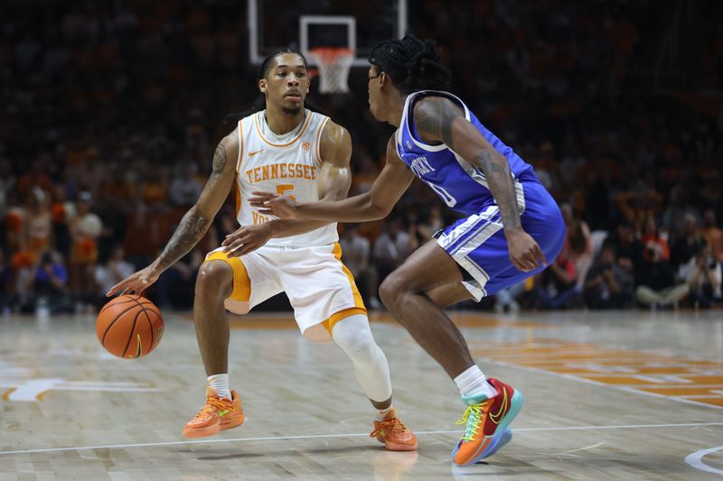 Mar 9, 2024; Knoxville, Tennessee, USA; Tennessee Volunteers guard Zakai Zeigler (5) moves the ball against the Kentucky Wildcats during the first half at Thompson-Boling Arena at Food City Center. Mandatory Credit: Randy Sartin-USA TODAY Sports