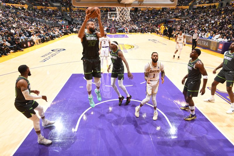 LOS ANGELES, CA - APRIL 7: Rudy Gobert #27 of the Minnesota Timberwolves rebounds the ball during the game against the Los Angeles Lakers on April 7, 2024 at Crypto.Com Arena in Los Angeles, California. NOTE TO USER: User expressly acknowledges and agrees that, by downloading and/or using this Photograph, user is consenting to the terms and conditions of the Getty Images License Agreement. Mandatory Copyright Notice: Copyright 2024 NBAE (Photo by Juan Ocampo/NBAE via Getty Images)