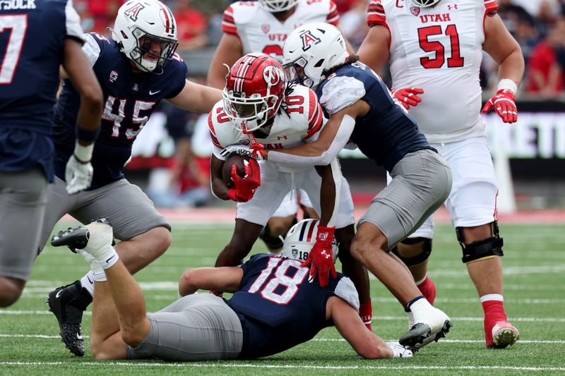 Nov 18, 2023; Tucson, Arizona, USA; Utah Utes wide receiver Money Parks (10) is tackled by Arizona Wildcats linebacker Jacob Manu (5) during the first half at Arizona Stadium. Mandatory Credit: Zachary BonDurant-USA TODAY Sports