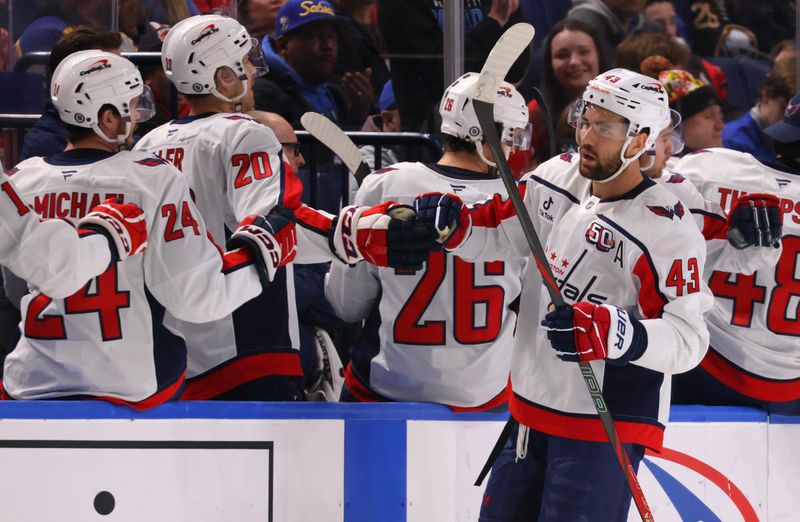 Jan 6, 2025; Buffalo, New York, USA;  Washington Capitals right wing Tom Wilson (43) celebrates his second goal of the game with teammates during the second period against the Buffalo Sabres at KeyBank Center. Mandatory Credit: Timothy T. Ludwig-Imagn Images