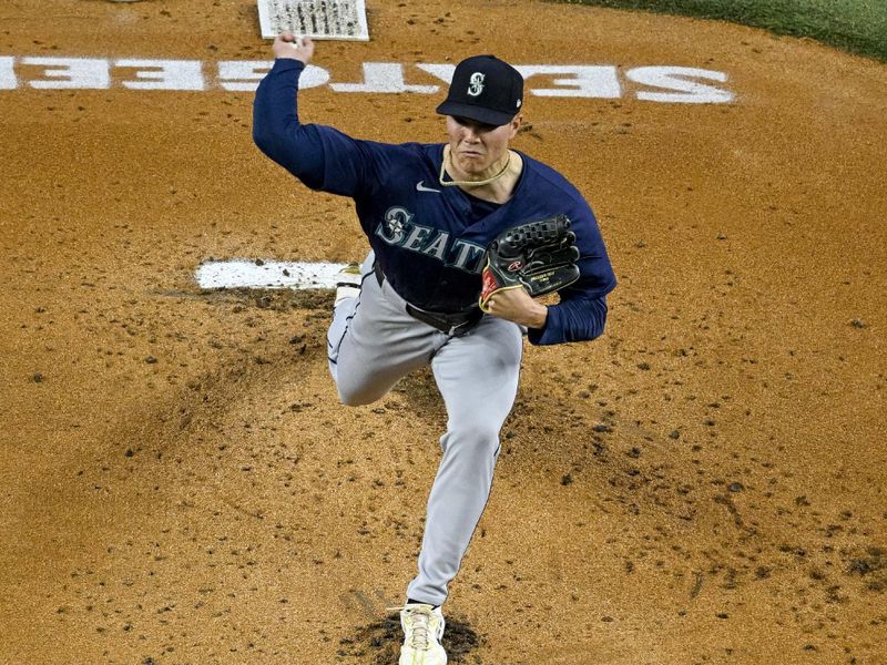 Sep 22, 2024; Arlington, Texas, USA; Seattle Mariners starting pitcher Bryan Woo (22) pitches against the Texas Rangers during the first inning at Globe Life Field. Mandatory Credit: Jerome Miron-Imagn Images