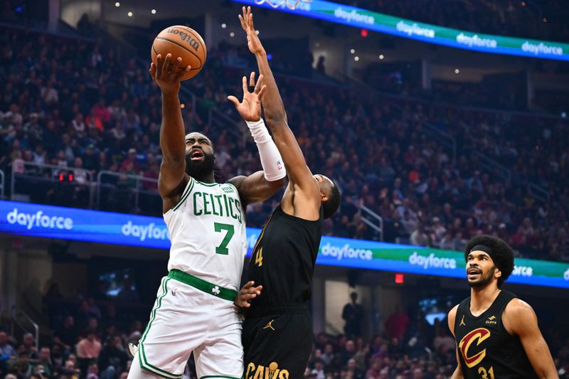 CLEVELAND, OHIO - MARCH 05: Jaylen Brown #7 of the Boston Celtics goes to basket against Evan Mobley #4 of the Cleveland Cavaliers during the first quarter at Rocket Mortgage Fieldhouse on March 05, 2024 in Cleveland, Ohio. NOTE TO USER: User expressly acknowledges and agrees that, by downloading and or using this photograph, User is consenting to the terms and conditions of the Getty Images License Agreement. (Photo by Jason Miller/Getty Images)