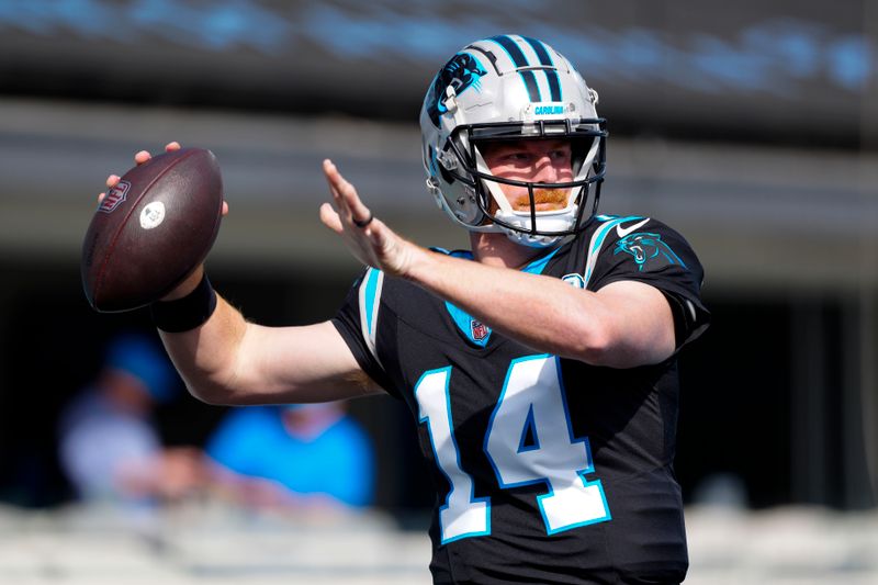 Carolina Panthers quarterback Andy Dalton warms up before an NFL football game between the Carolina Panthers and the New Orleans Saints Sunday, Nov. 3, 2024, in Charlotte, N.C. (AP Photo/Jacob Kupferman)