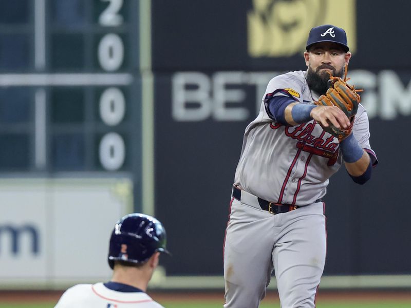 Apr 17, 2024; Houston, Texas, USA; Atlanta Braves second base Luis Guillorme (15) forces Houston Astros third base Alex Bregman (2) out at second base but is not able to turn the double play in time in the seventh inning at Minute Maid Park. Mandatory Credit: Thomas Shea-USA TODAY Sports