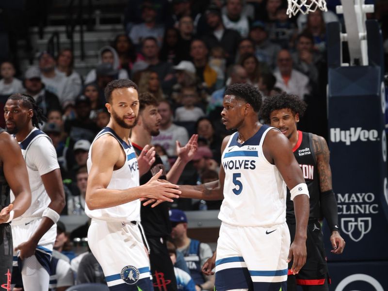 MINNEAPOLIS, MN -  FEBRUARY 4: Kyle Anderson #1 high fives Anthony Edwards #5 of the Minnesota Timberwolves during the game against the Houston Rockets on February 4, 2024 at Target Center in Minneapolis, Minnesota. NOTE TO USER: User expressly acknowledges and agrees that, by downloading and or using this Photograph, user is consenting to the terms and conditions of the Getty Images License Agreement. Mandatory Copyright Notice: Copyright 2024 NBAE (Photo by David Sherman/NBAE via Getty Images)