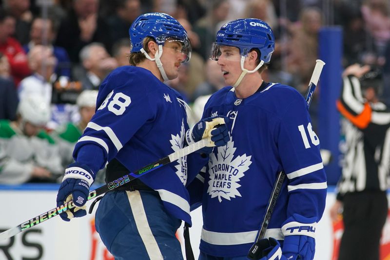 Jan 14, 2025; Toronto, Ontario, CAN; Toronto Maple Leafs forward William Nylander (88) and forward Mitch Marner (16) talk during a break in the action against the Dallas Stars during the third period at Scotiabank Arena. Mandatory Credit: John E. Sokolowski-Imagn Images