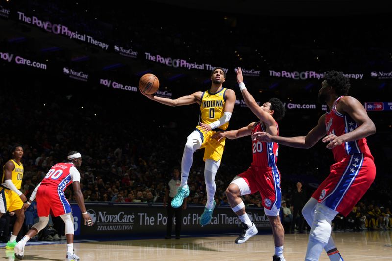 PHILADELPHIA, PA - DECEMBER 13: Tyrese Haliburton #0 of the Indiana Pacers drives to the basket during the game against the Philadelphia 76ers on December 13, 2024 at the Wells Fargo Center in Philadelphia, Pennsylvania NOTE TO USER: User expressly acknowledges and agrees that, by downloading and/or using this Photograph, user is consenting to the terms and conditions of the Getty Images License Agreement. Mandatory Copyright Notice: Copyright 2024 NBAE (Photo by Jesse D. Garrabrant/NBAE via Getty Images)