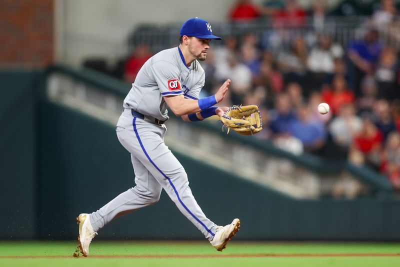 Sep 27, 2024; Atlanta, Georgia, USA; Kansas City Royals second baseman Michael Massey (19) fields a ground ball against the Atlanta Braves in the second inning at Truist Park. Mandatory Credit: Brett Davis-Imagn Images