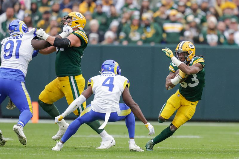 Green Bay Packers running back Aaron Jones (33) rushes during an NFL football game between the Green Bay Packers and Los Angeles Rams Sunday, Nov. 5, 2023, in Green Bay, Wis. (AP Photo/Matt Ludtke)