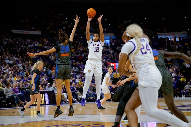 Feb 4, 2024; Baton Rouge, Louisiana, USA; LSU Lady Tigers guard Mikaylah Williams (12) makes a shot against Florida Gators guard Jeriah Warren (20) during the first half at Pete Maravich Assembly Center. Mandatory Credit: Matthew Hinton-USA TODAY Sports