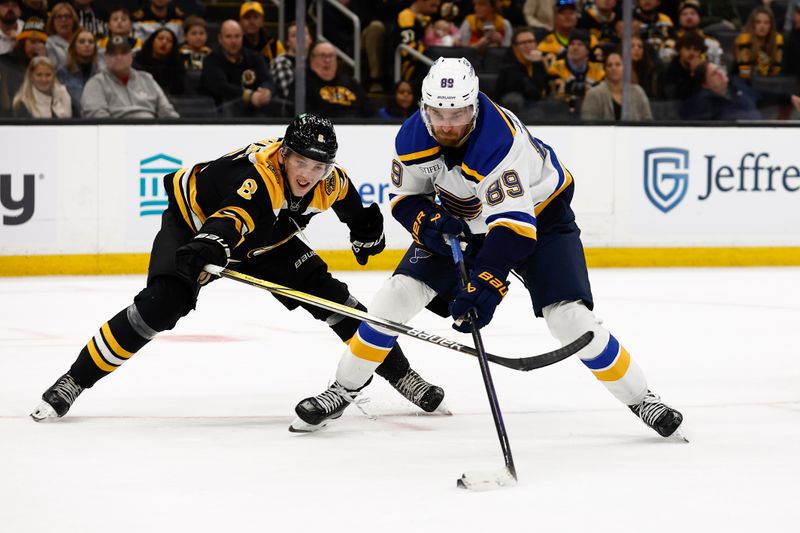 Nov 16, 2024; Boston, Massachusetts, USA; Boston Bruins defenseman Mason Lohrei (6) tries to stop St. Louis Blues left wing Pavel Buchnevich (89) from taking a shot in the slot during the third period at TD Garden. Mandatory Credit: Winslow Townson-Imagn Images